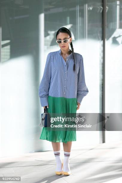 Digital Influencer Vicky Lee wears a Baum und Pferogarten dress, De Beers necklace and earrings, Julia Mays shoes, Black eyewear sunglasses and an...