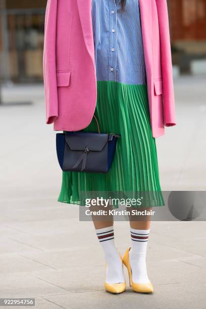Digital Influencer Vicky Lee wears a Theory coat, Baum und Pferogarten dress, Julia Mays shoes and an Alexandra De Curtis bag on day 2 of London...