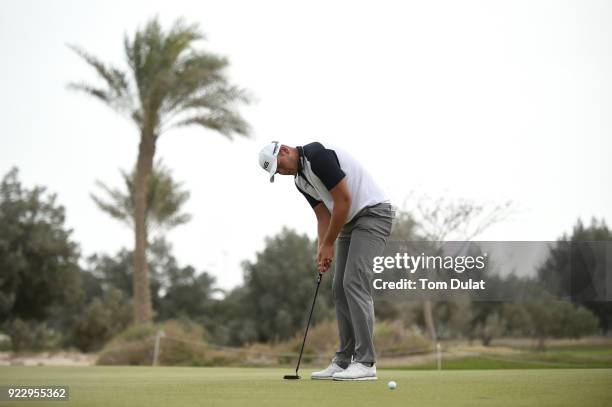 Jonathan Thomson of England putts on the 7th green during the first round of the Commercial Bank Qatar Masters at Doha Golf Club on February 22, 2018...