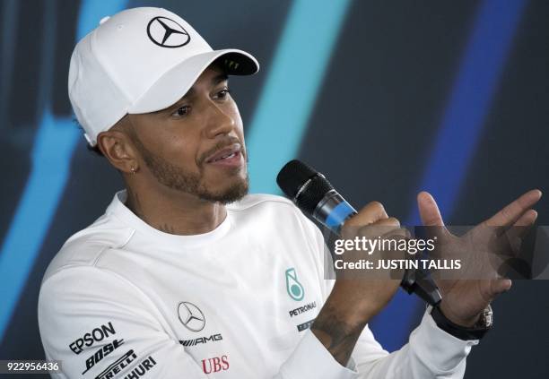 Mercedes AMG Petronas Formula One driver, Britain's Lewis Hamilton speaks at a press conference prior to the launch of the new 2018 season...