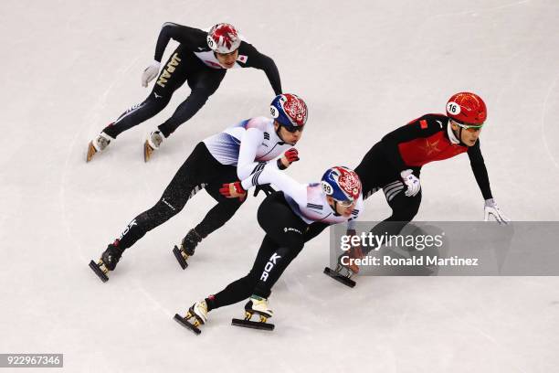 Ziwei Ren of China, Hyojun Lim of Korea, Daeheon Hwang of Korea and Ryosuke Sakazume of Japan compete during the Short Track Speed Skating - Men's...