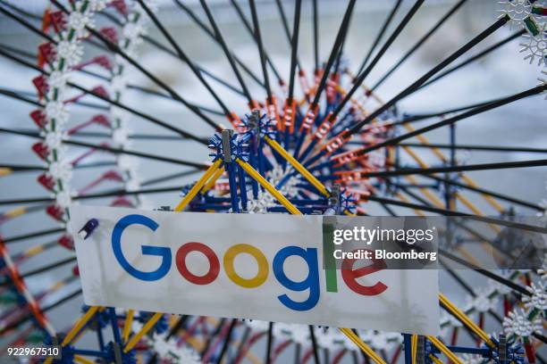 Signage is displayed on a K'nex Industries Inc. Toy ferris wheel in the lobby of the new Google Inc. Campus in Boulder, Colorado, U.S., on Wednesday,...