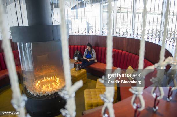 An employee works on a laptop computer near a fireplace at the new Google Inc. Campus in Boulder, Colorado, U.S., on Wednesday, Feb. 21, 2018. Google...