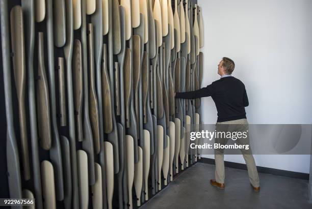 Member of the media pushes a row of oars that leads to a secret conference room at the new Google Inc. Campus in Boulder, Colorado, U.S., on...