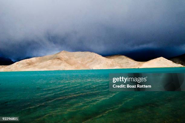 pamir mountains - lake karakul stock pictures, royalty-free photos & images