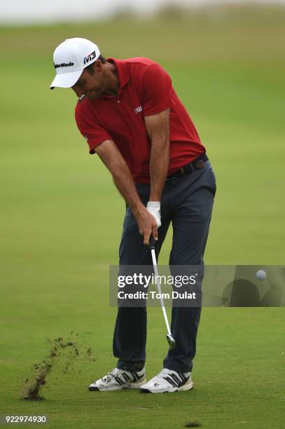 Edoardo Molinari of Italy hits an approach shot during the first round of the Commercial Bank Qatar Masters at Doha Golf Club on February 22, 2018 in...