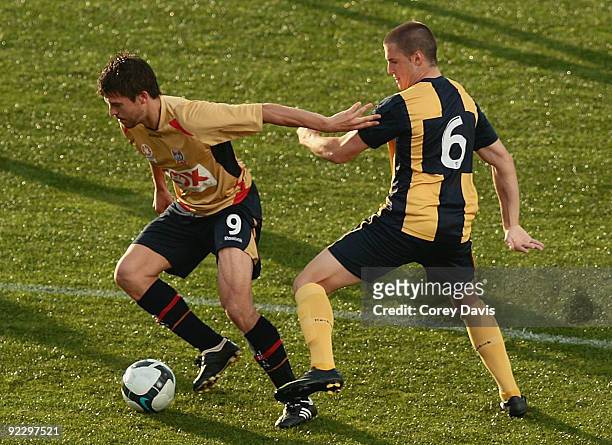 Danny De Groot of the Jets is challenged by Emmanuel Giannaros of the Mariners during the round seven National Youth League match between the...