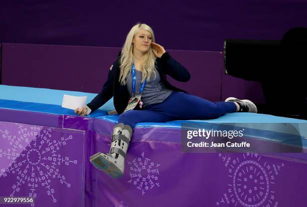 Elise Christie of Great Britain attends from the side of the rink the venue victory ceremony with her boyfriend Shaolin Sandor Liu of Hungary and his...