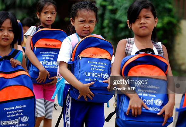 Students from Nangka Elementary School receive school supplies donated by the United Nations Childrens Fund in Marikina, east of Manila on October...