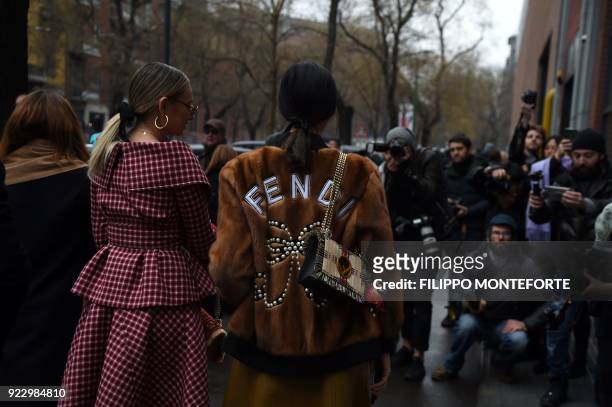 Women pose prior to the women's Fall/Winter 2018/2019 collection fashion show by Fendi in Milan, on February 22, 2018. / AFP PHOTO / Filippo...