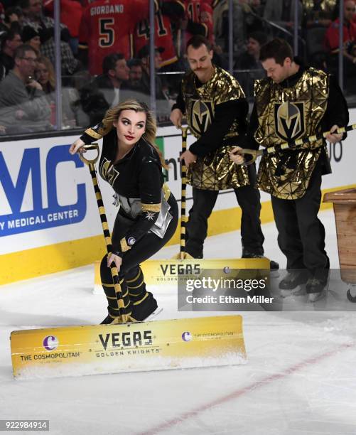 Members of the Knights Crew clean the ice during the Vegas Golden Knights' game against the Calgary Flames at T-Mobile Arena on February 21, 2018 in...