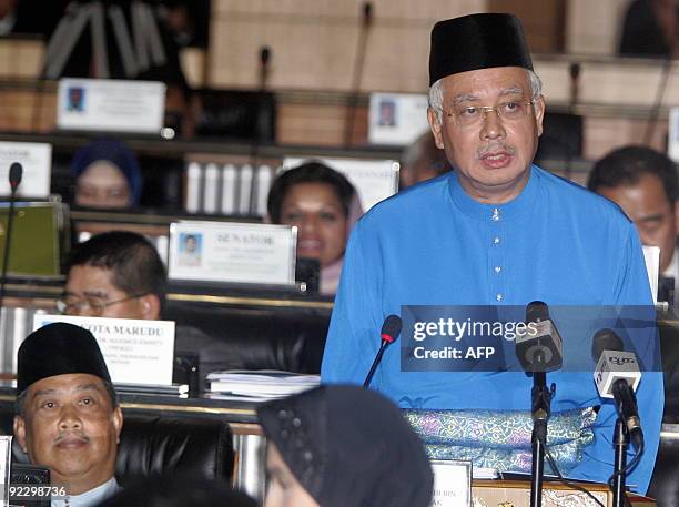 Malaysian Prime Minister Najib Razak and his deputy Muhyiddin Yassin present the 2010 budget at Parliament House in Kuala Lumpur, on October 23,...