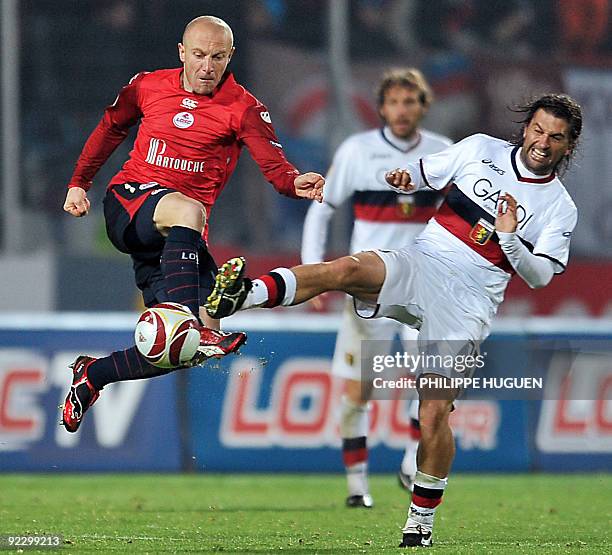 Lille's French midfielder Florent Balmont vies with Genoa midfielder Omar Milanetto during their UEFA Europa League Group B football match Lille vs....