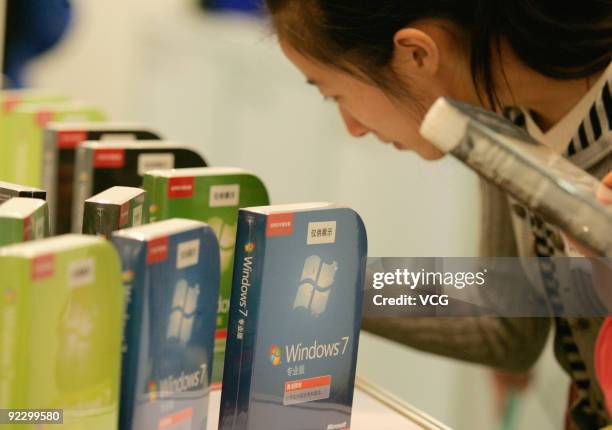 Woman looks at the new operating system Microsoft Windows 7 on October 23, 2009 in Beijing, China. Windows 7 is Microsoft's most important release in...