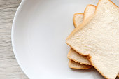 Toasted slice of bread on white plate