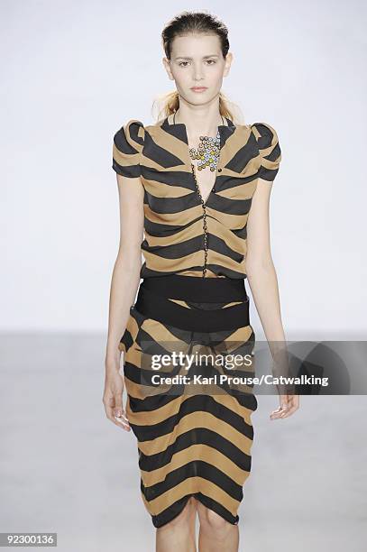 Model walks the runway during the Veronique Leroy ready to wear show as part of the Paris Womenswear Fashion Week Spring/Summer 2010 at Espace...