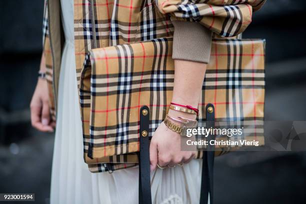 Aylin Koenig wearing Burberry jacket, Burberry bag, creme white dress seen outside Max Mara during Milan Fashion Week Fall/Winter 2018/19 on February...