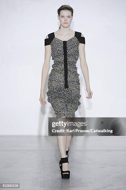 Model walks the runway during the Veronique Leroy ready to wear show as part of the Paris Womenswear Fashion Week Spring/Summer 2010 at Espace...