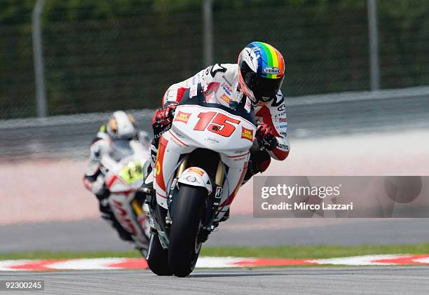 Alex De Angelis of Rep. San Marino and San Carlo Honda Gresini heads down a straight during the free practice for the Malaysian MotoGP, which is...