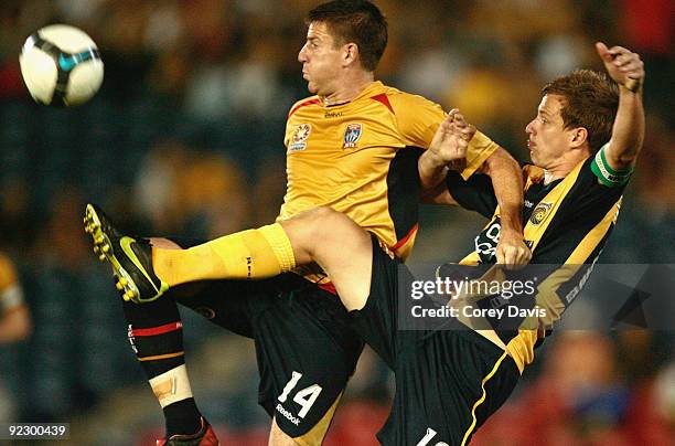 Alex Wilkinson of the Mariners and Michael Bridges of the Jets contest the ball during the round 12 A-League match between the Newcastle Jets and the...