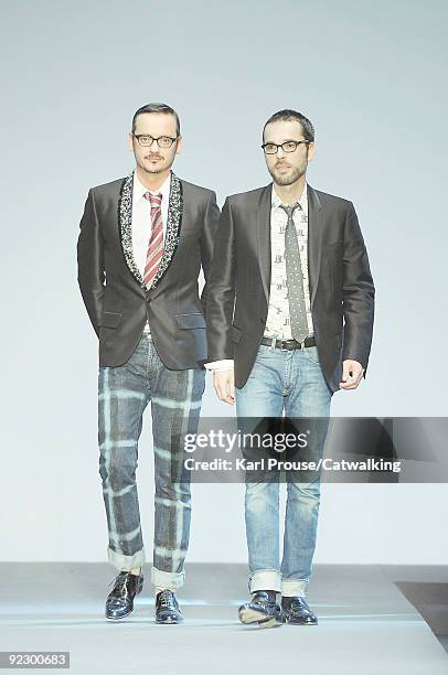 Designers Viktor Horsting and Rolf Snoeren walk the runway during the Viktor & Rolf ready to wear show during Paris Womenswear Fashion Week...