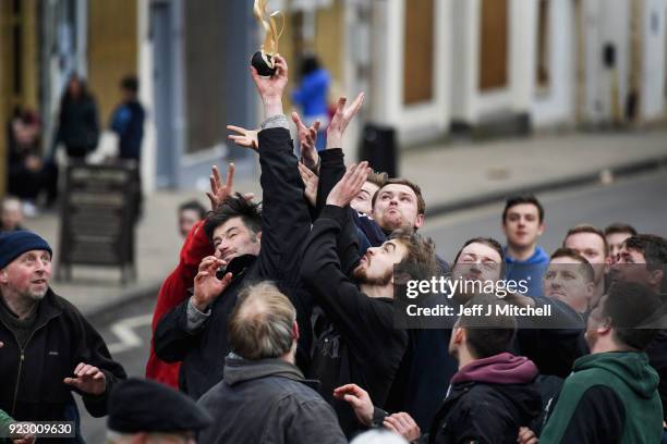 Men chase after the leather ball during the annual 'Fastern Eve Handba' event in Jedburgh's High Street in the Scottish Borders on February 22, 2018...