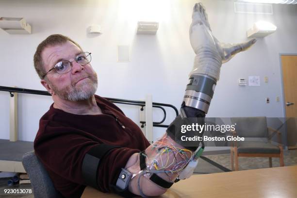 Air Force veteran Ron Currier poses for a portrait with a LUKE Arm at Next Step Bionics and Prosthetics, Inc. In Manchester, NH on Feb. 13, 2018....