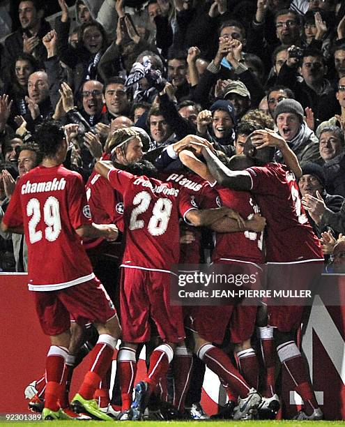 Bordeaux' players celebrate after Marc Planus scored a goal during their Champions League football match Bordeaux versus Bayern Munich on October 21,...