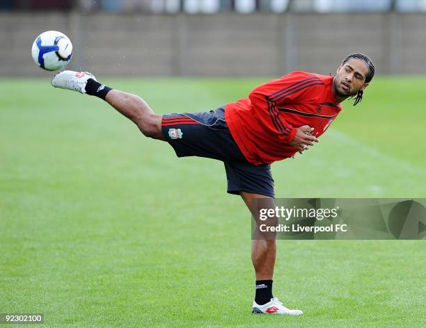 Liverpool defender Glen Johnson stretches for the ball during a training session at the team's Melwood Training Ground on October 23 in Liverpool,...