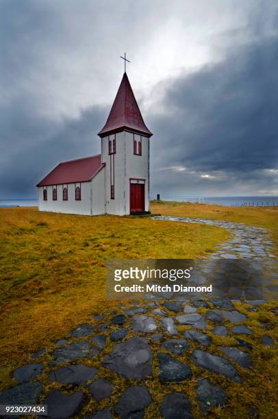 the famous church in hellnar iceland - hellnar stock pictures, royalty-free photos & images