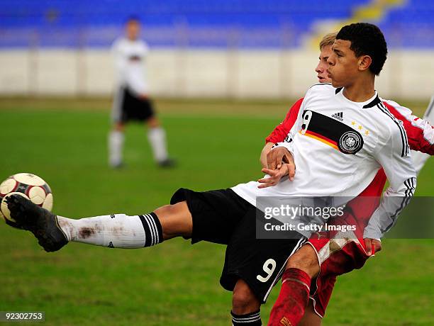 Shawn Parker of Germany and Marjan Mitev of Macedonia fight for the ball during the U17 Euro qualifying match between Germany and Macedonia at the...