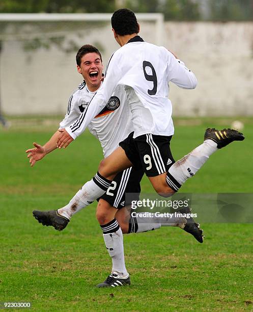 Shawn Parker of Germany jubilates with team mate Niklas Kreuzer after scoring during the U17 Euro qualifying match between Germany and Macedonia at...