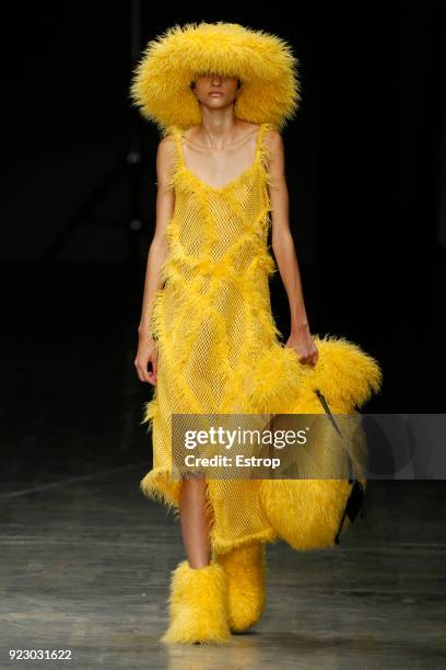 Model walks the runway at the Angel Chen show during Milan Fashion Week Fall/Winter 2018/19 on February 21, 2018 in Milan, Italy.