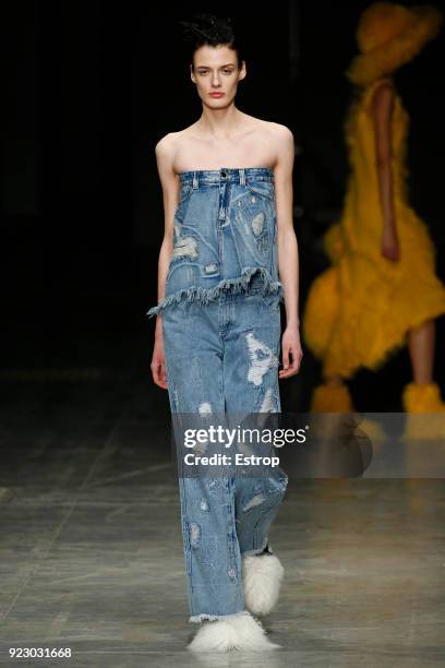 Model walks the runway at the Angel Chen show during Milan Fashion Week Fall/Winter 2018/19 on February 21, 2018 in Milan, Italy.