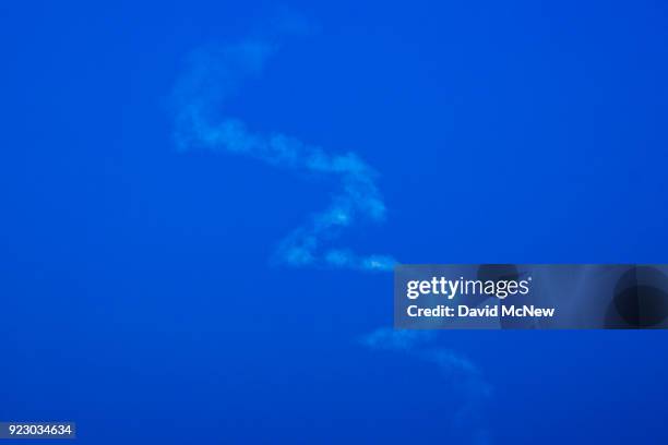 SpaceX Falcon 9 rocket's trail is seen from the San Gabriel Mountains, more than 100 miles away, as it rises from Vandenberg Air Force Base on...