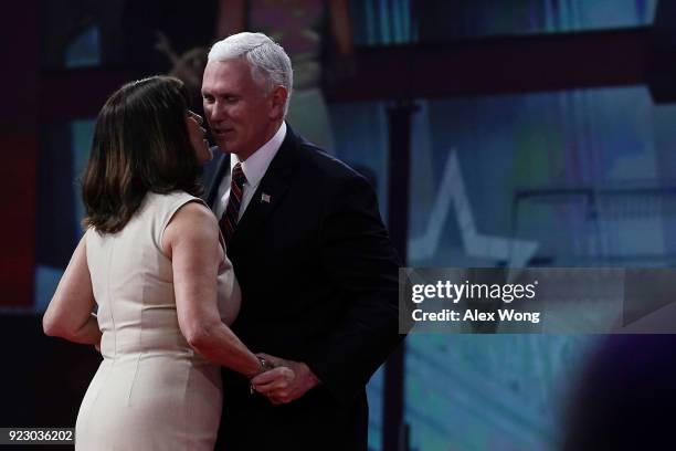 Vice President Mike Pence is greeted by his wife and second lady Karen Pence on stage during CPAC 2018 February 22, 2018 in National Harbor,...