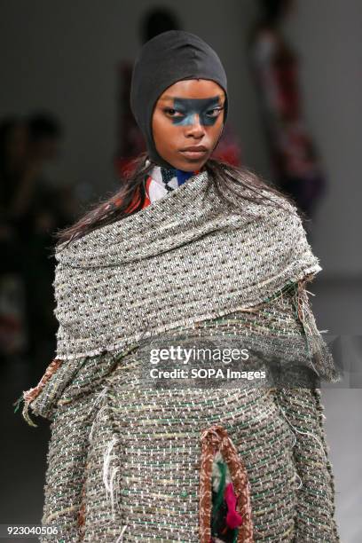 Model walks the runway at the Matty Bovan Show during London Fashion Week February 2018 at BFC Show Space.