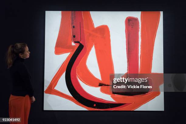 Member of staff looks at Andy Warhol's Hammer and Sickle on February 22nd, 2018 at the preview for Sotheby's upcoming Impressionist, Modern and...