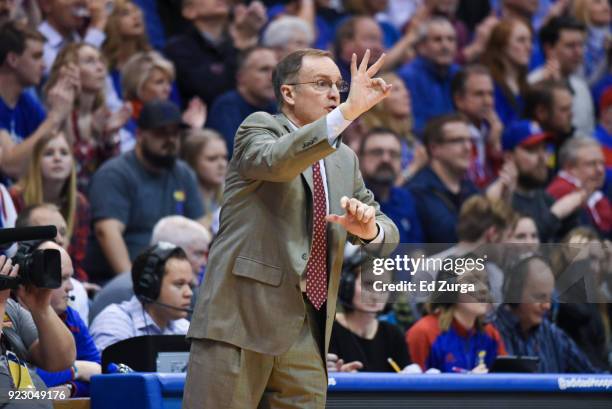 Lon Kruger directs his team against the Kansas Jayhawks at Allen Fieldhouse on February 19, 2018 in Lawrence, Kansas.