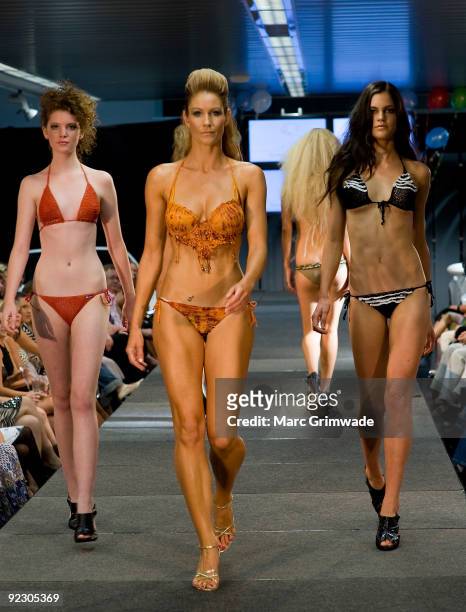 Models showcase a design on the catwalk by Syrene Bikinis during the Sunshine Coast Fashion Festival at the Coastline BMW Showroom on October 23,...