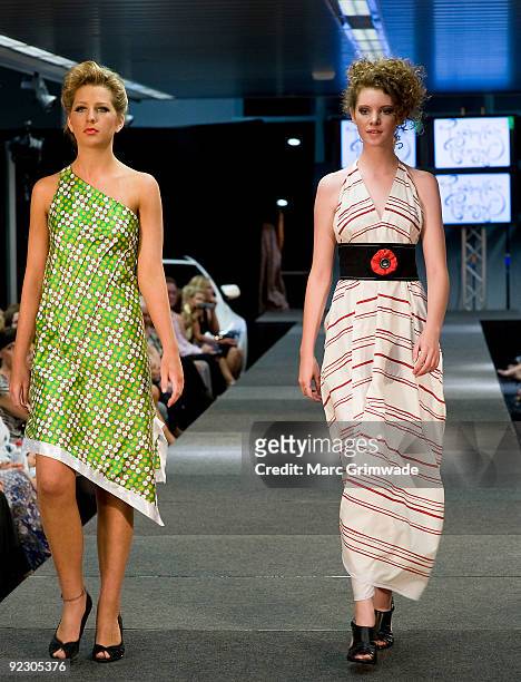 Model showcases a design on the catwalk by Isabella's Closet during the Sunshine Coast Fashion Festival at the Coastline BMW Showroom on October 23,...