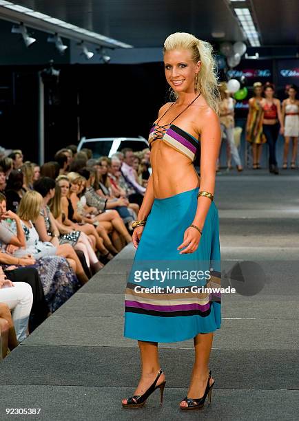 Model showcases a design on the catwalk by Eklectic Mix during the Sunshine Coast Fashion Festival at the Coastline BMW Showroom on October 23, 2009...