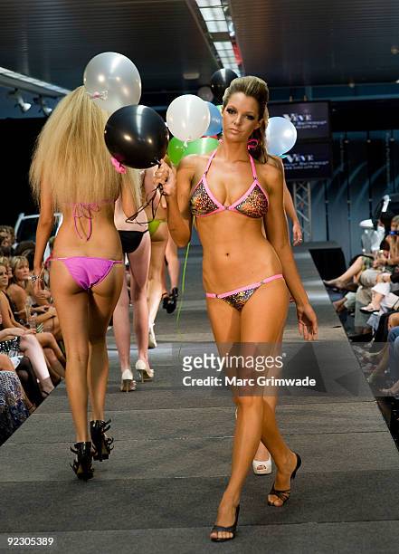 Model showcases a design on the catwalk by Veve during the Sunshine Coast Fashion Festival at the Coastline BMW Showroom on October 23, 2009 in...