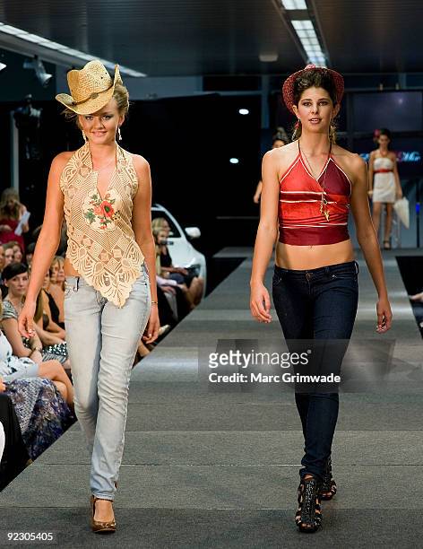 Model showcases a design on the catwalk by Eklectic Mix during the Sunshine Coast Fashion Festival at the Coastline BMW Showroom on October 23, 2009...