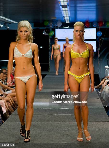 Models showcase a design on the catwalk by Syrene Bikinis during the Sunshine Coast Fashion Festival at the Coastline BMW Showroom on October 23,...