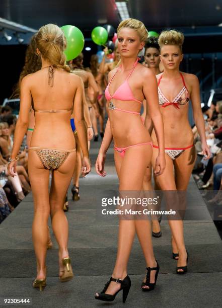Models showcase a design on the catwalk by Veve during the Sunshine Coast Fashion Festival at the Coastline BMW Showroom on October 23, 2009 in...