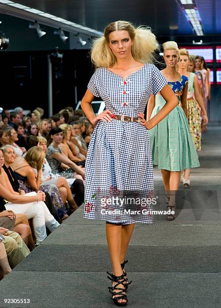 Model showcases a design on the catwalk by Blossom Betty during the Sunshine Coast Fashion Festival at the Coastline BMW Showroom on October 23, 2009...