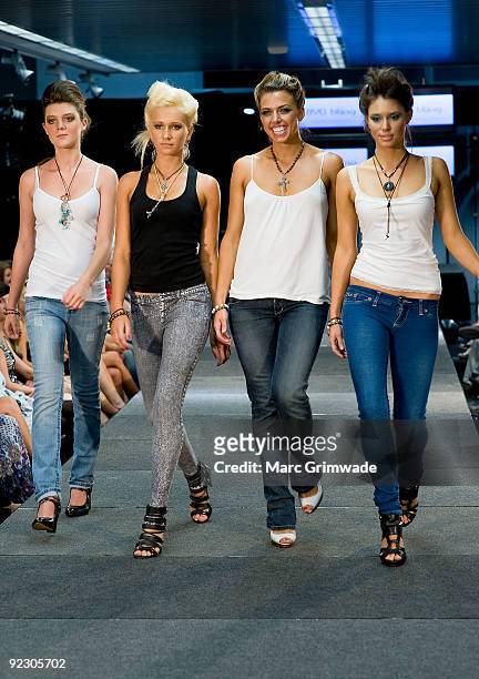 Models showcase a design on the catwalk by BYO Bling during the Sunshine Coast Fashion Festival at the Coastline BMW Showroom on October 23, 2009 in...