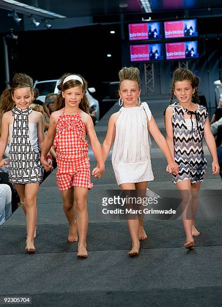 Models showcase a design on the catwalk by Birikini during the Sunshine Coast Fashion Festival at the Coastline BMW Showroom on October 23, 2009 in...