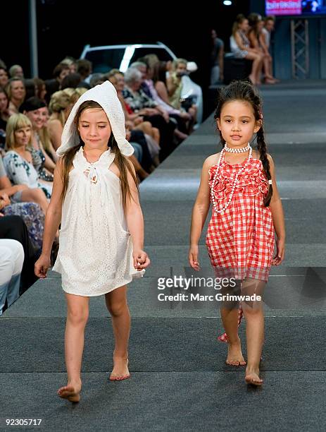 Models showcase a design on the catwalk by Birikini during the Sunshine Coast Fashion Festival at the Coastline BMW Showroom on October 23, 2009 in...